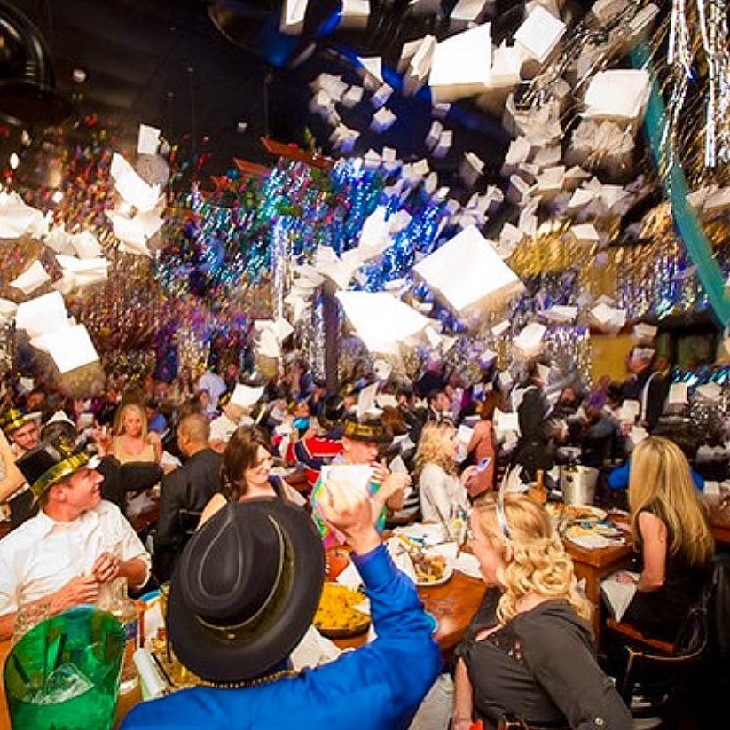 New Year's Eve party at Taverna Opa. Throwing napkins and confetti