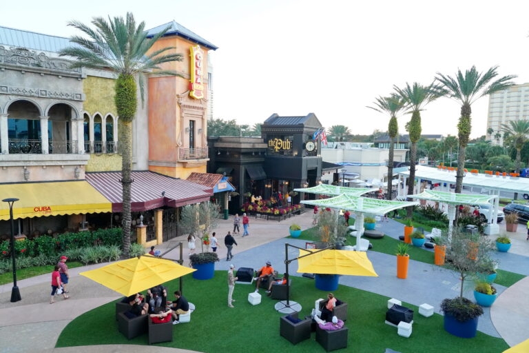 Photo of the courtyard area featuring Cuba Libre, The Pub and seating areas at Pointe Orlando
