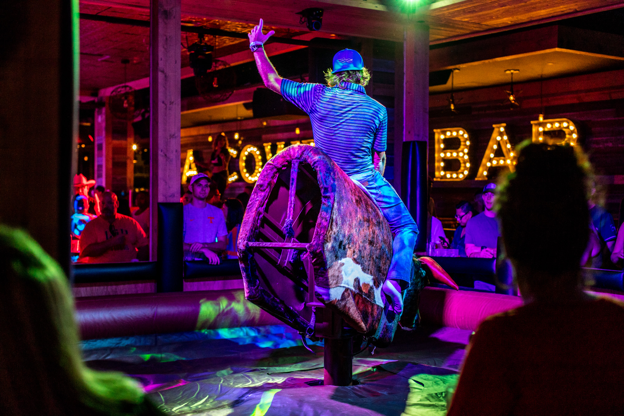 Man riding a mechanical bull